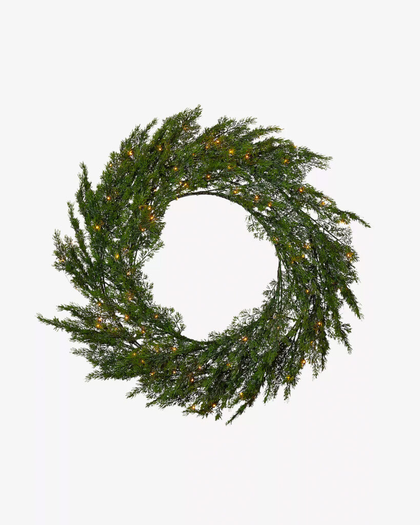 julkrans med belysning gron pa ytterdorren eller inne